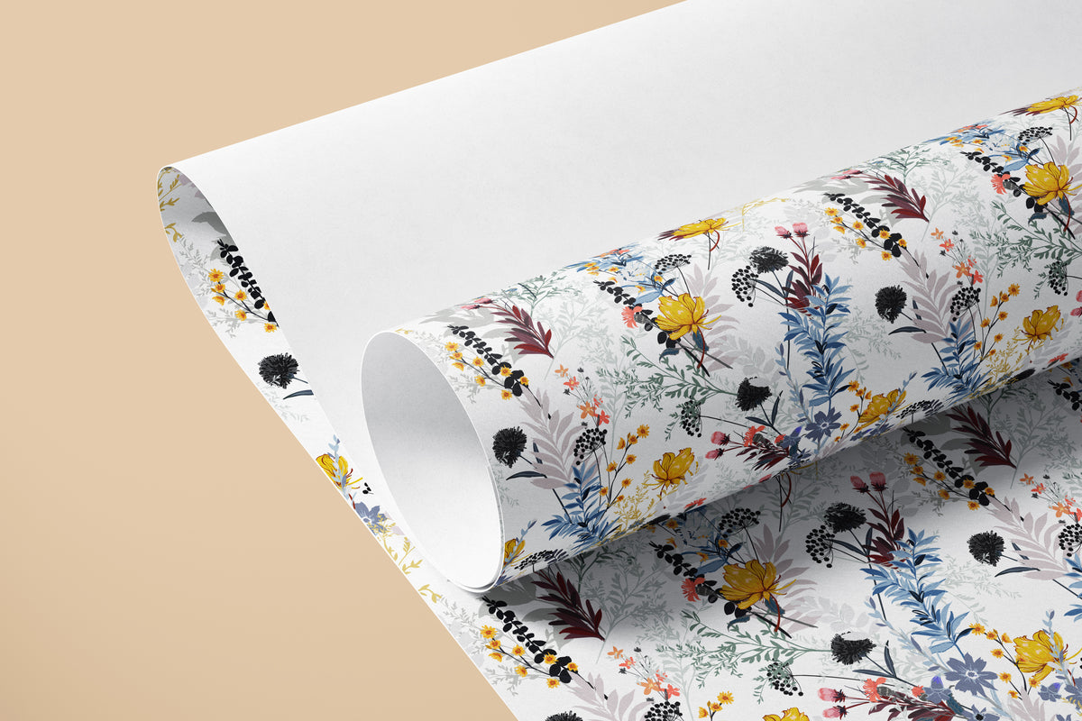 Roll of Wildflower Wonderland contact paper with blue foliage, yellow and coral wildflowers on white, partly unrolled against a tan backdrop