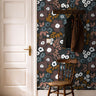 Deep florals styled in warm and brightly lit hallway