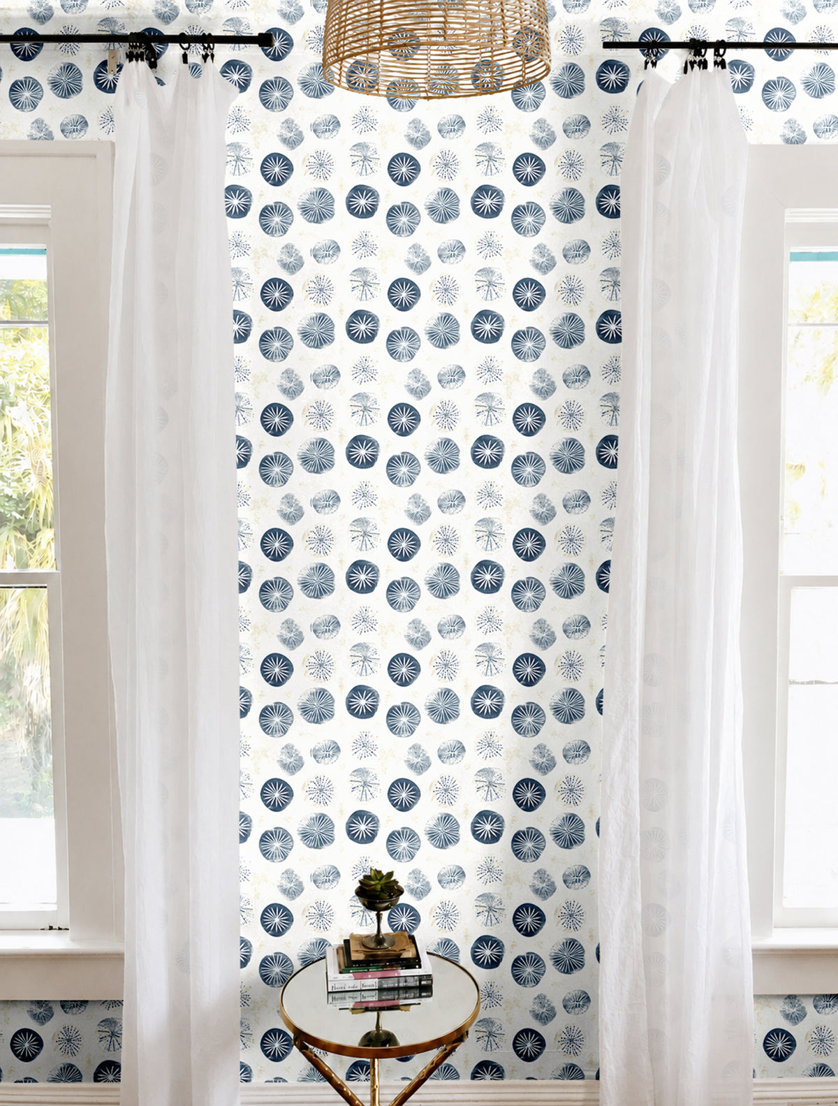 Navy and white sand dollar geometric print in brightly lit white living room
