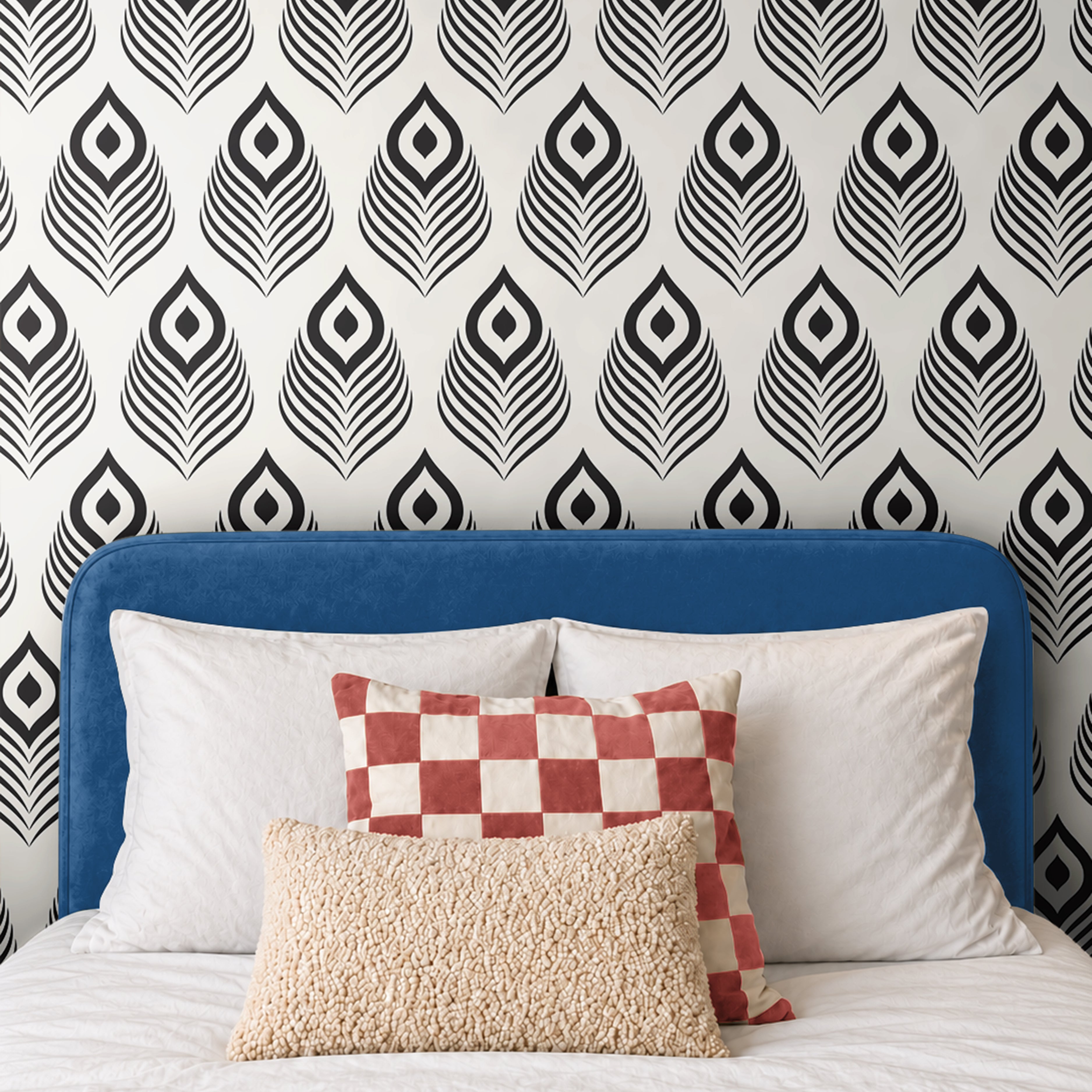Black Modern 1162 wallpaper featuring a bold black and white geometric peacock feather pattern, styled in a contemporary bedroom with a blue upholstered headboard, white bedding, and decorative accent pillows.