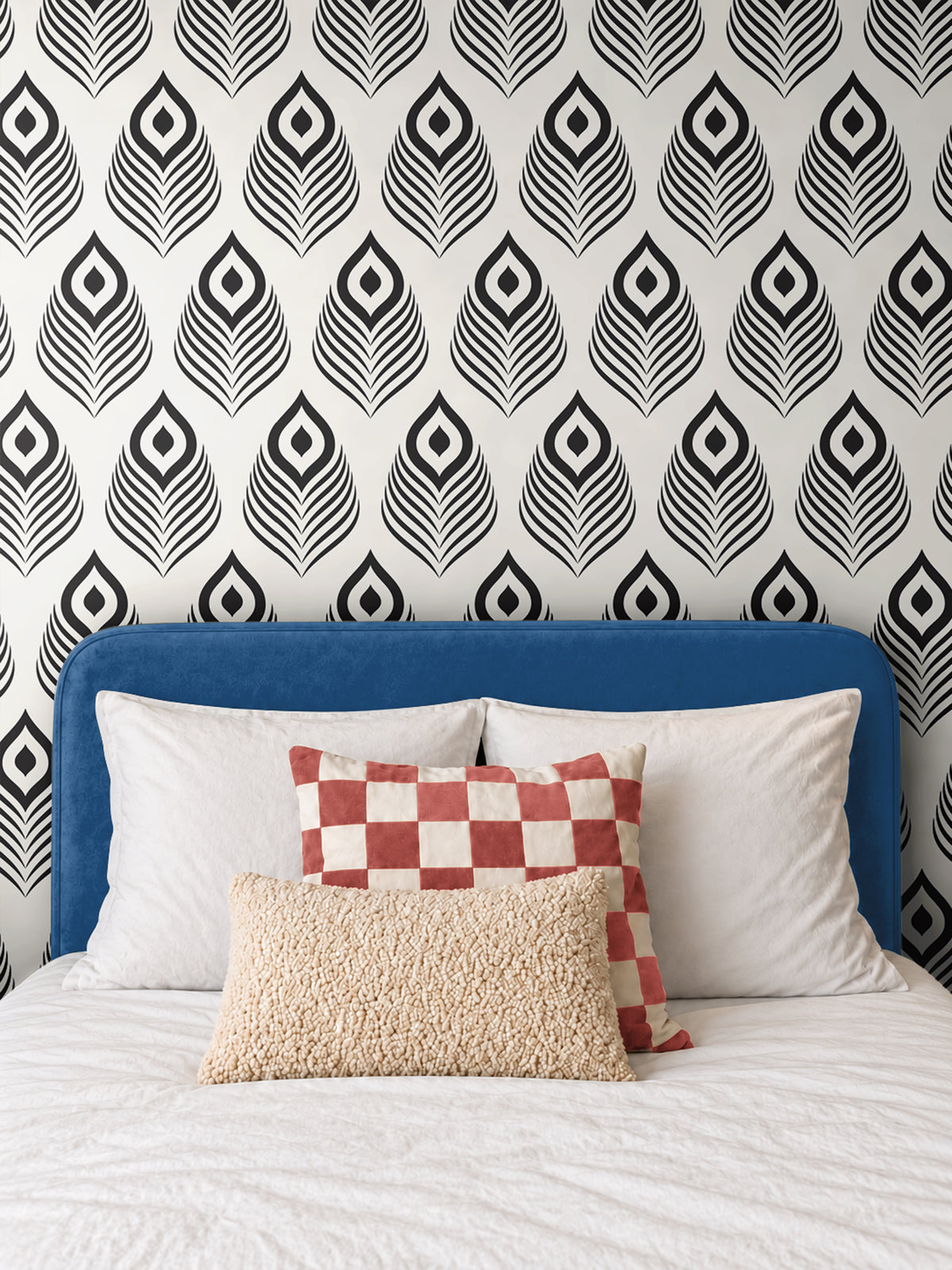 Black Modern 1162 wallpaper featuring a bold black and white geometric peacock feather pattern, styled in a contemporary bedroom with a blue upholstered headboard, white bedding, and decorative accent pillows.
