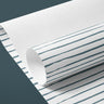Detail view of blue and white striped contact paper with hand-drawn lines and a clean, understated farmhouse style.