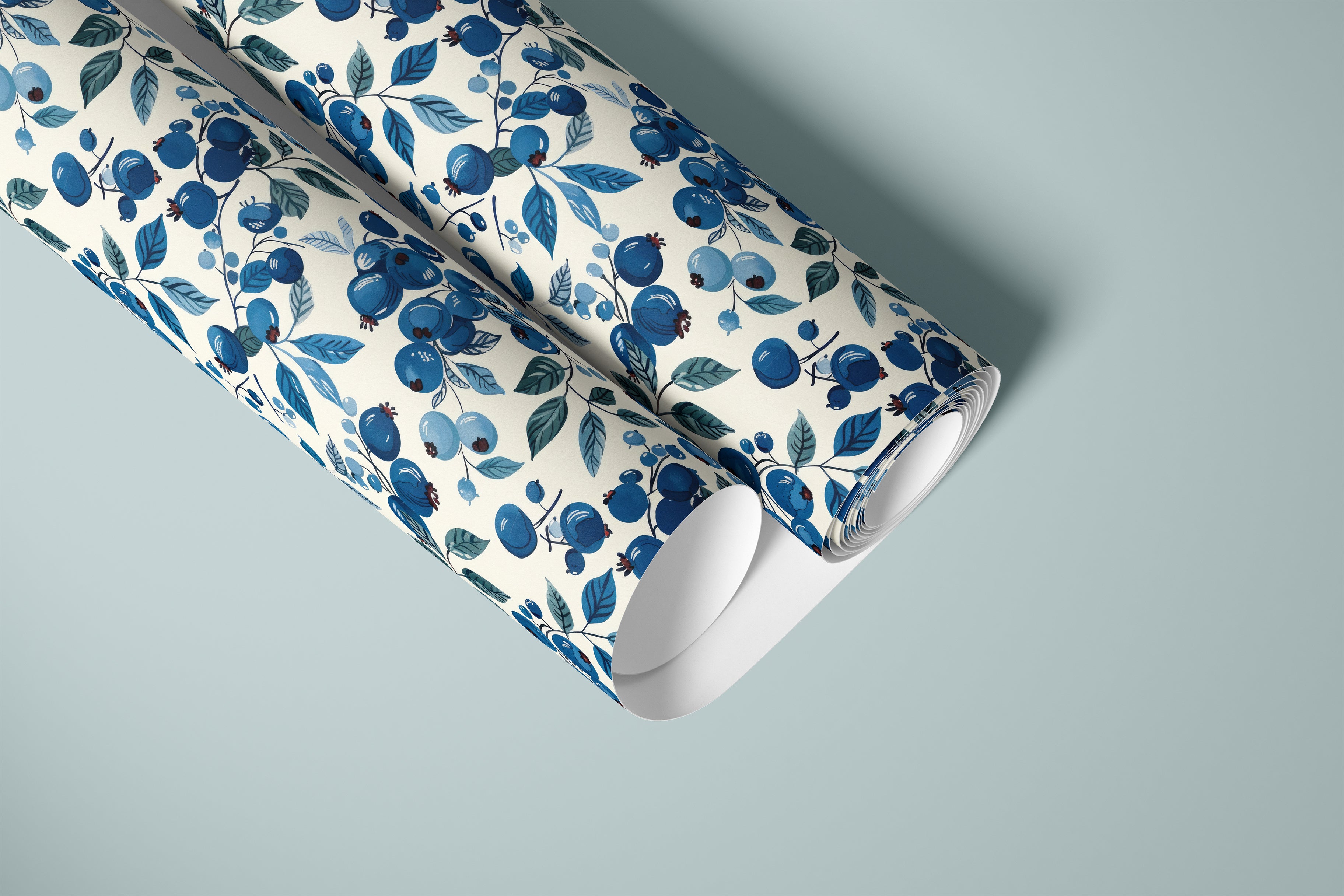roll of blueberry branches contact paper with blue berries teal leaves and warm cream background