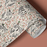 Roll of peel and stick contact paper featuring gray owls, rust berries and leafy branches on a soft cream background.