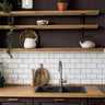 cabernet and gentry 3550 dark burgundy floral wallpaper in kitchen with wood shelves tile and dark cabinets