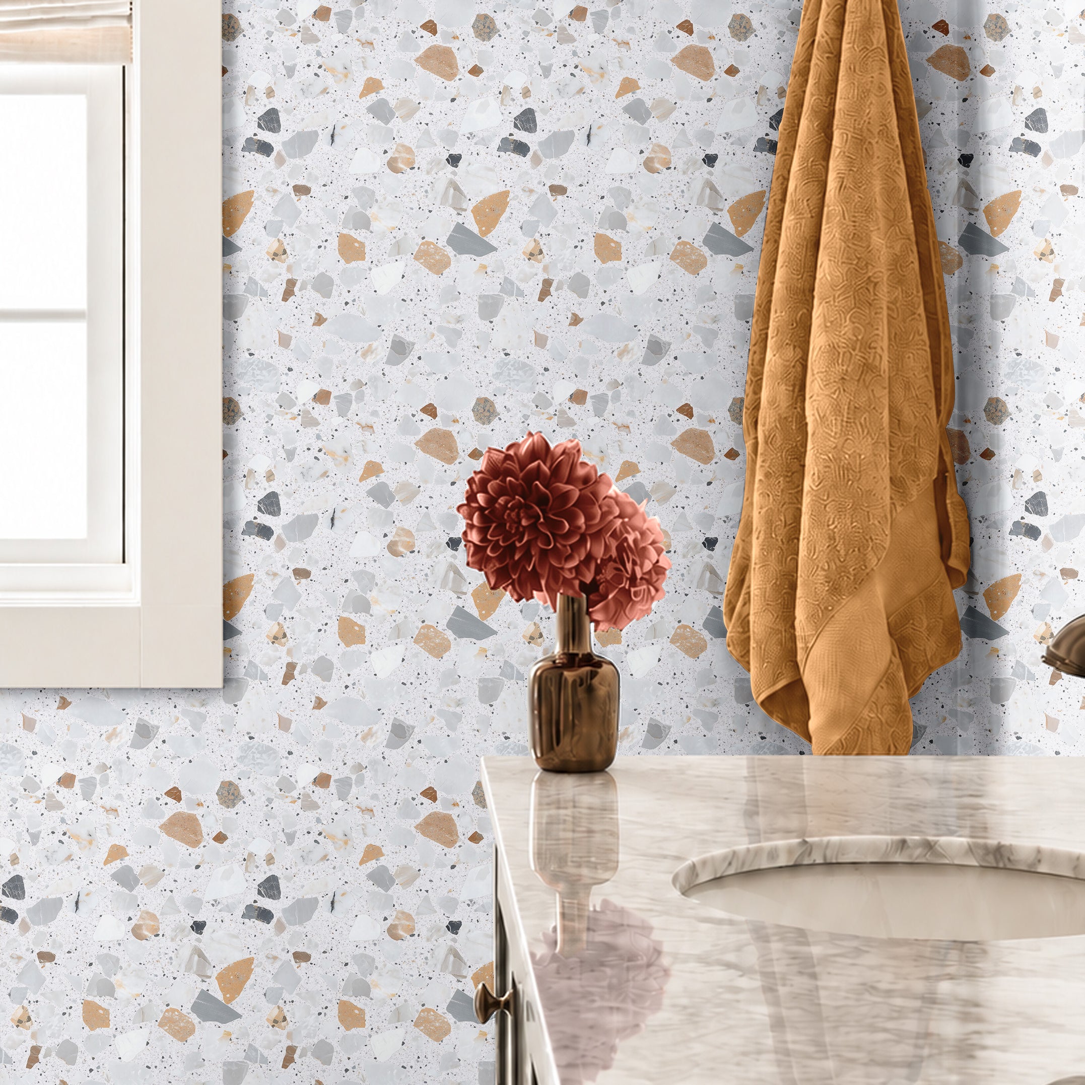 Cielo Terra 3144 terrazzo wallpaper with warm beige, gray and charcoal stone shapes on a soft white background styled in a modern bathroom