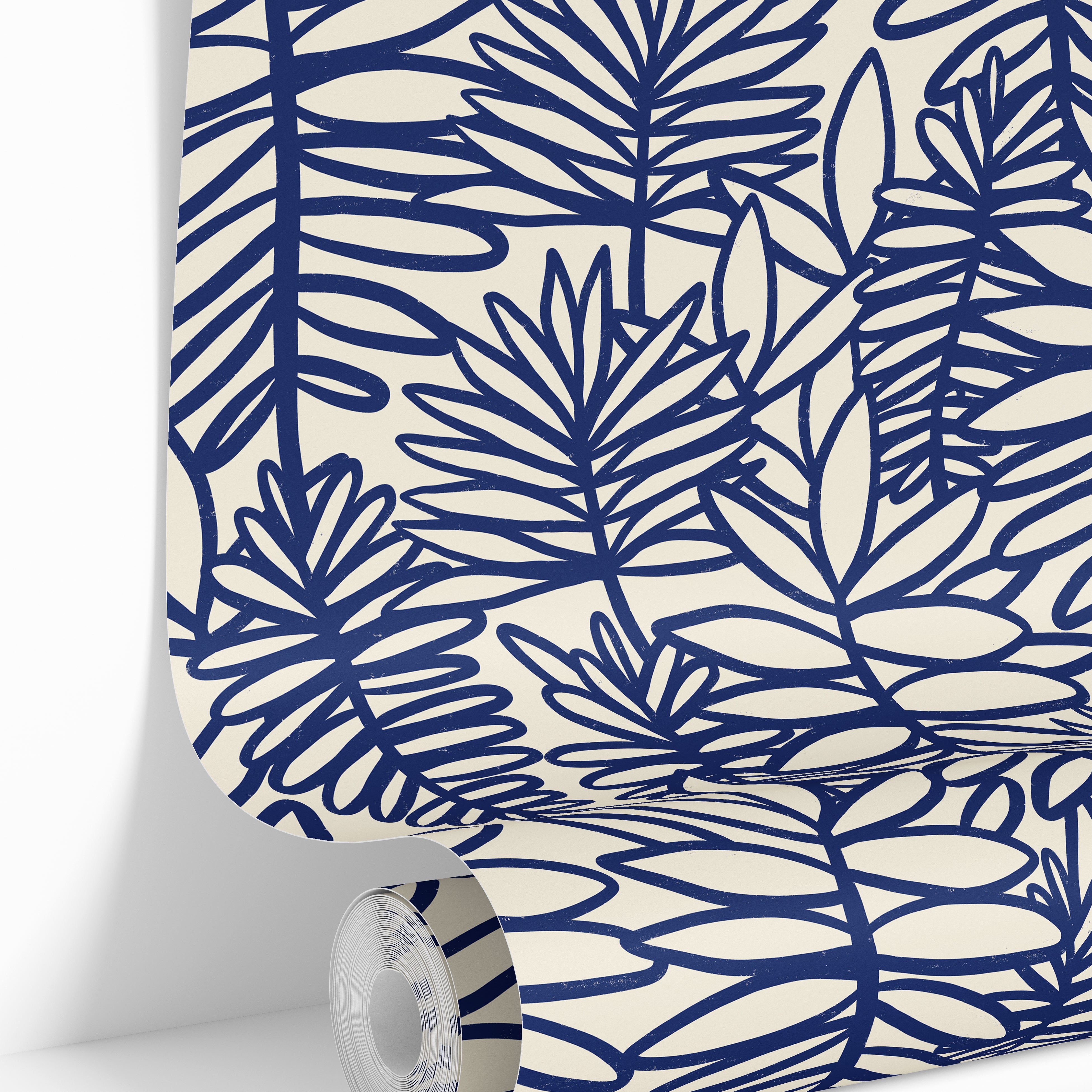 Wallpaper roll featuring Coastal Theory blue botanical wallpaper with oversized tropical foliage.