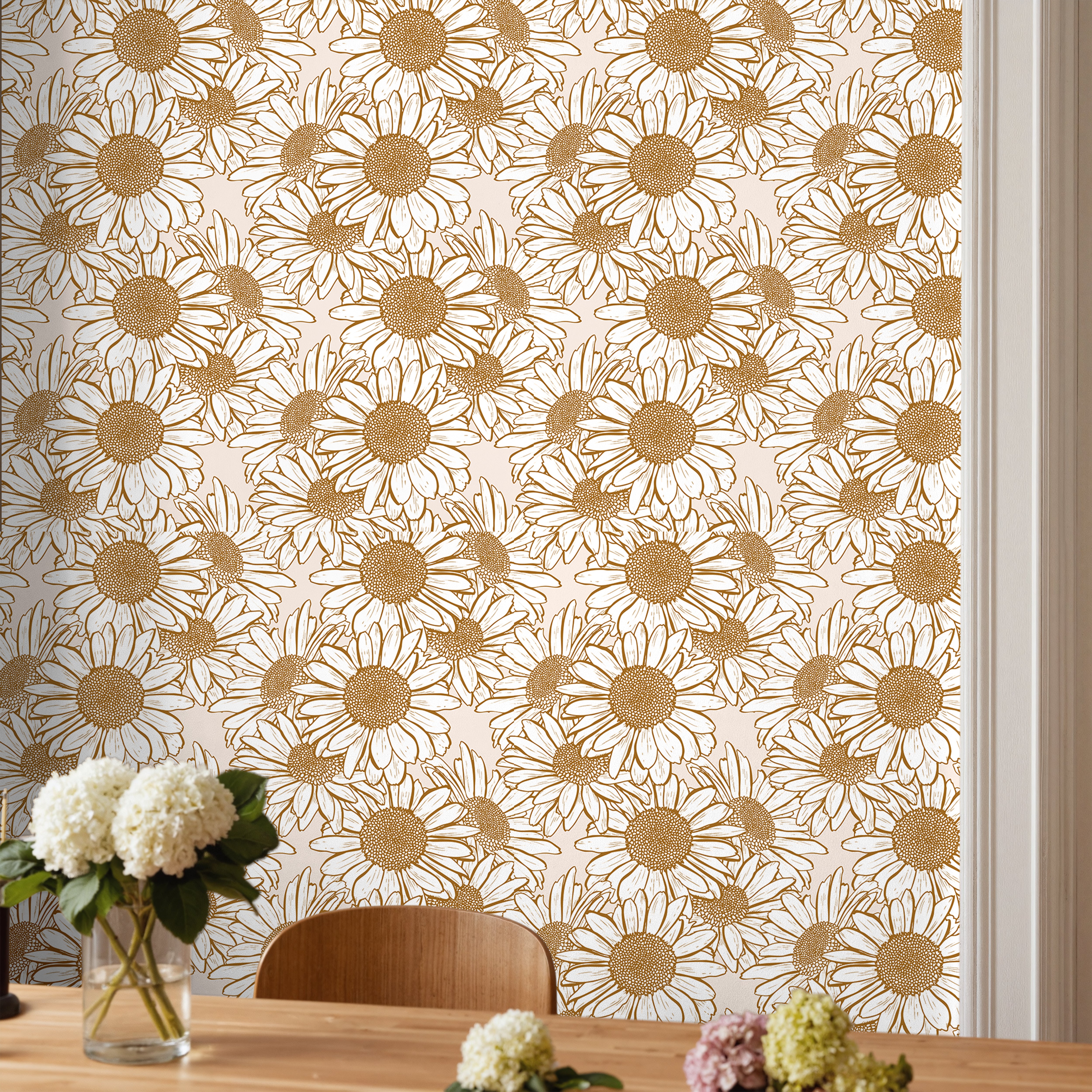 Daisy Hour golden daisy floral wallpaper styled in a warm dining room with natural wood furniture and soft neutral decor