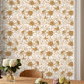 Daisy Hour golden daisy floral wallpaper styled in a warm dining room with natural wood furniture and soft neutral decor
