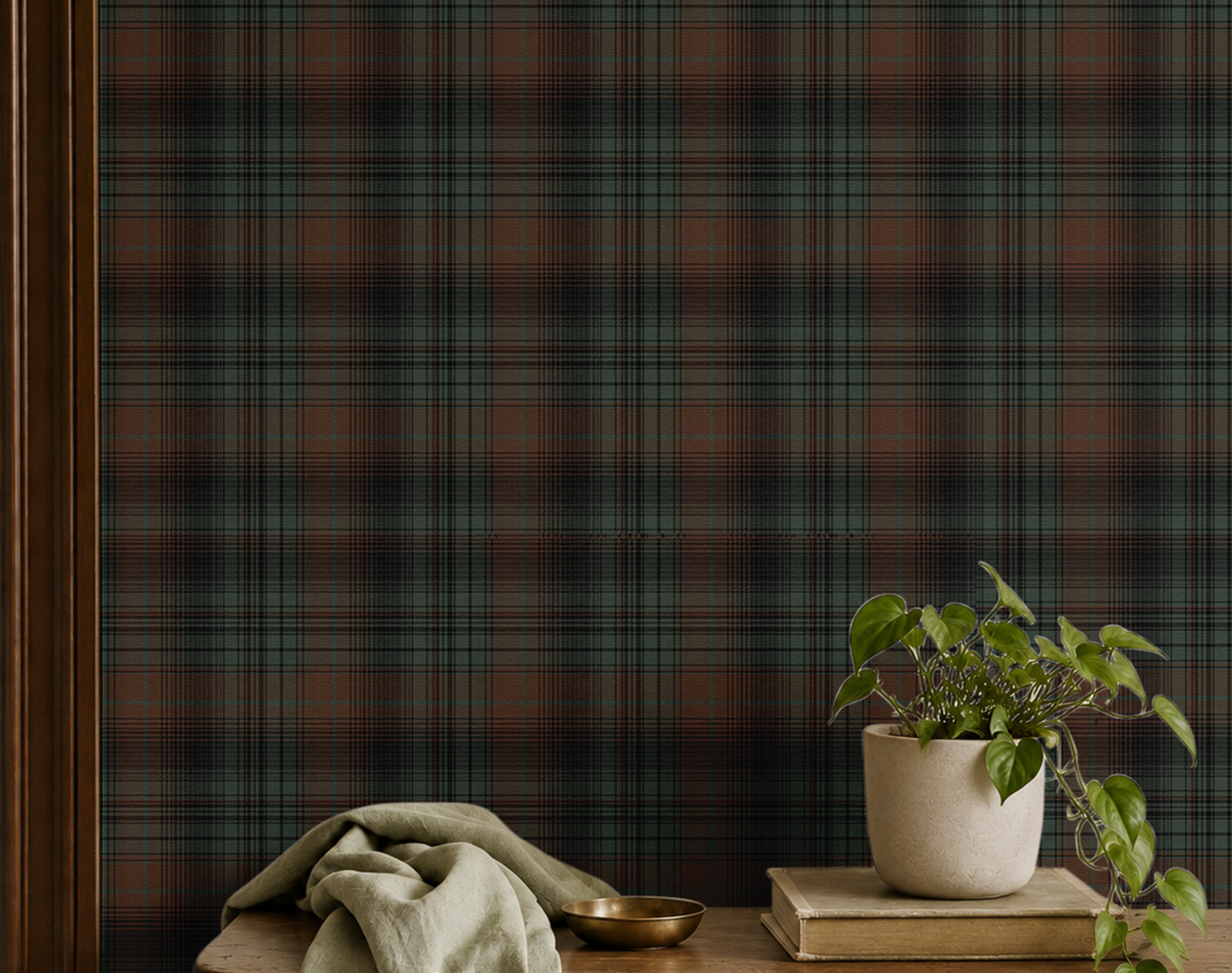 dark green charcoal and russet plaid wallpaper behind wood shelf with books, plants and cloth