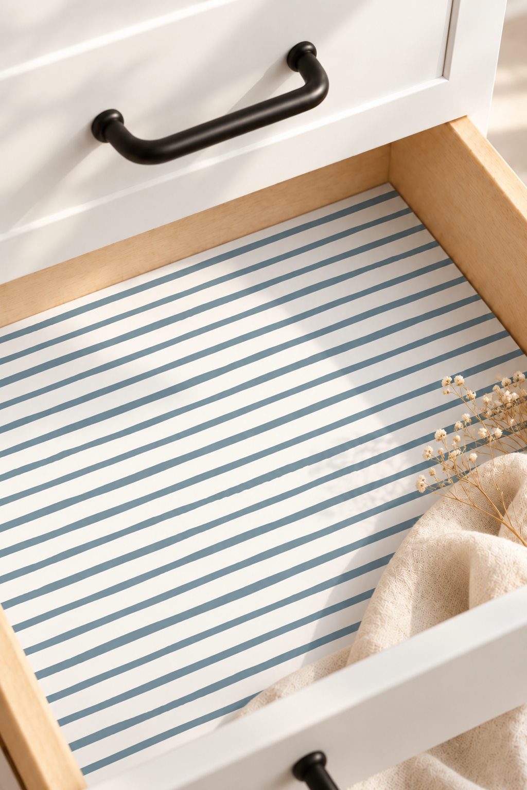 Hand-drawn slate blue stripes on a crisp white background Installed in white drawers