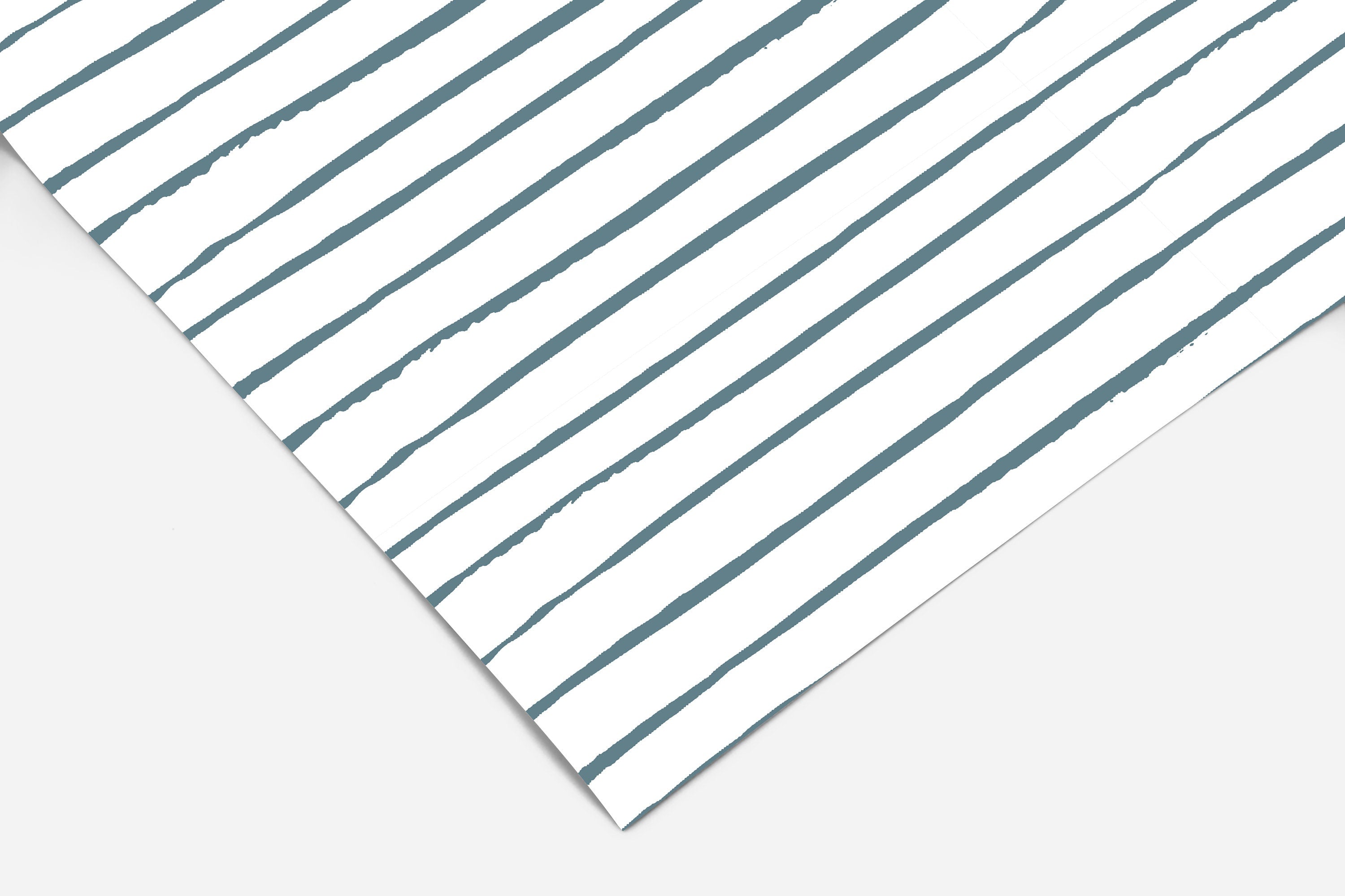 Farmhouse peel and stick shelf liner featuring irregular slate blue stripes on white in a simple linear design.