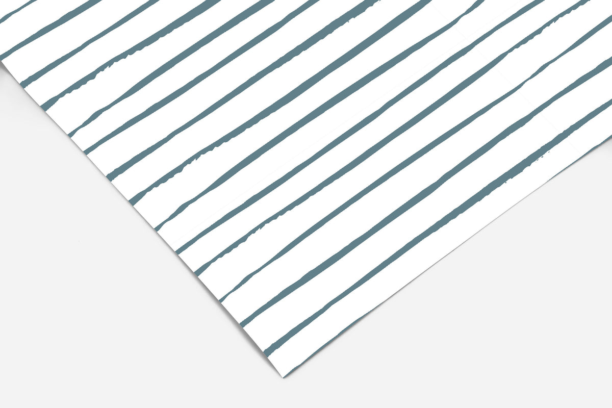 Farmhouse peel and stick shelf liner featuring irregular slate blue stripes on white in a simple linear design.