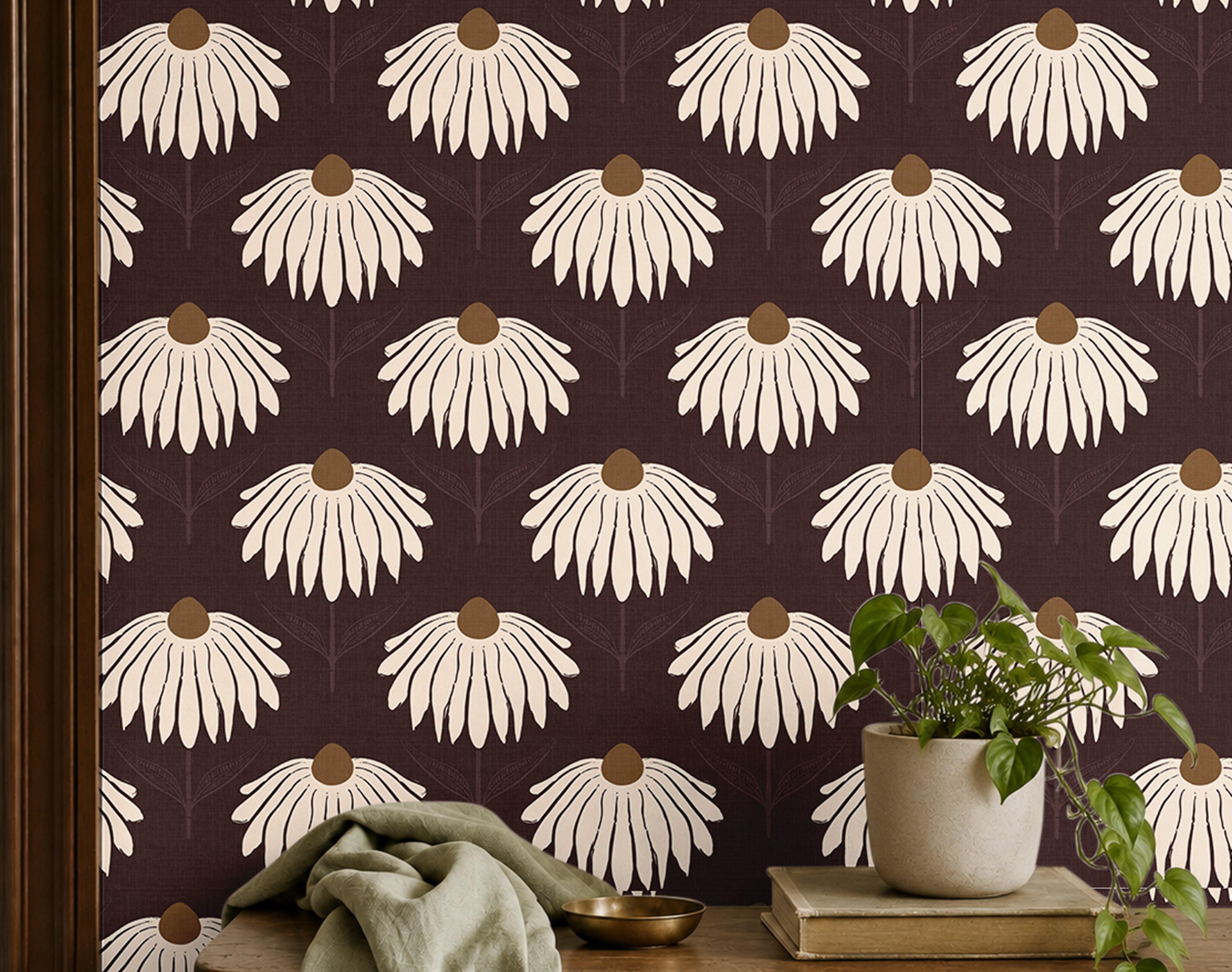 garnet crown 3543 burgundy coneflower wallpaper behind wood shelf with green plant books and sage fabric