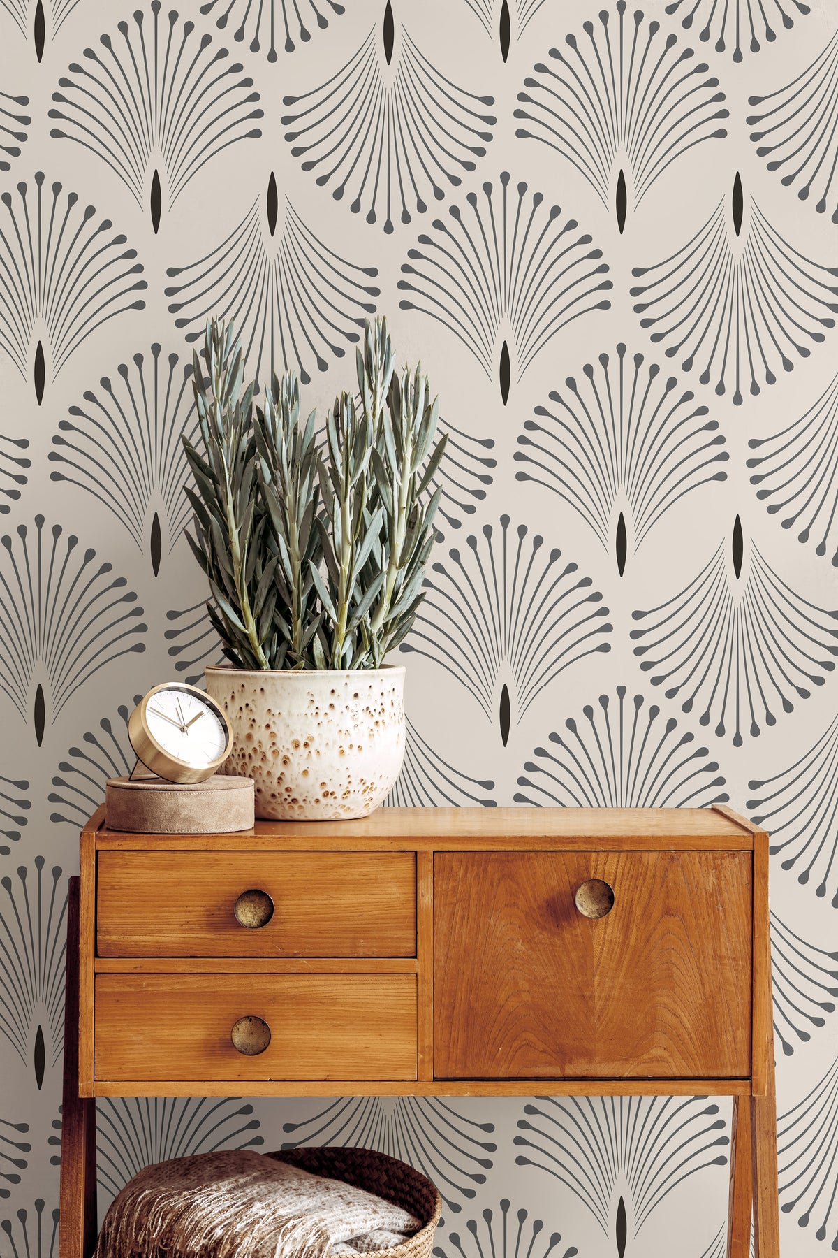 Neutral Art Deco wallpaper with repeating fan motifs styled beside warm wood furniture and soft organic decor