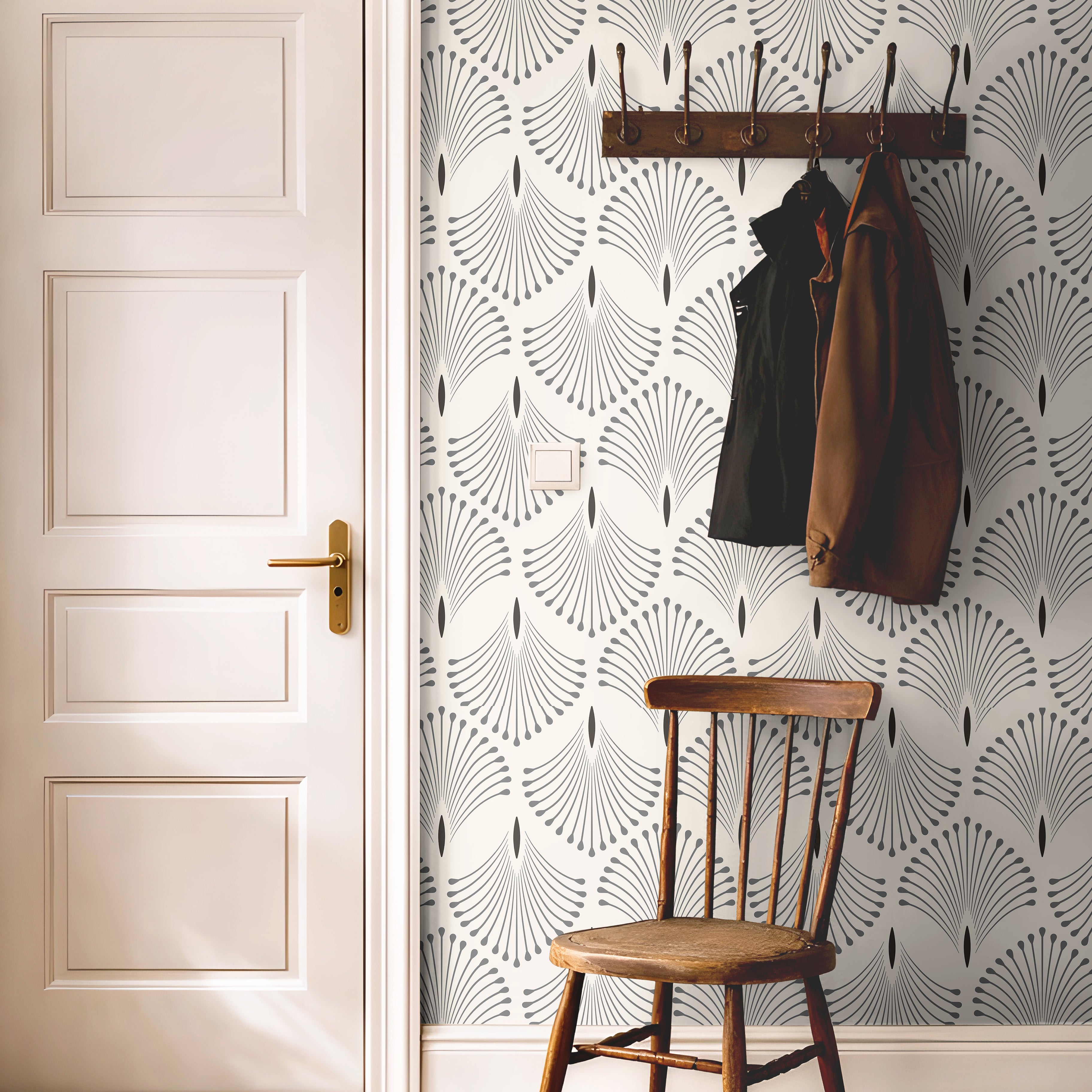Taupe geometric wallpaper with minimalist Art Deco styling and repeating botanical fan motifs.