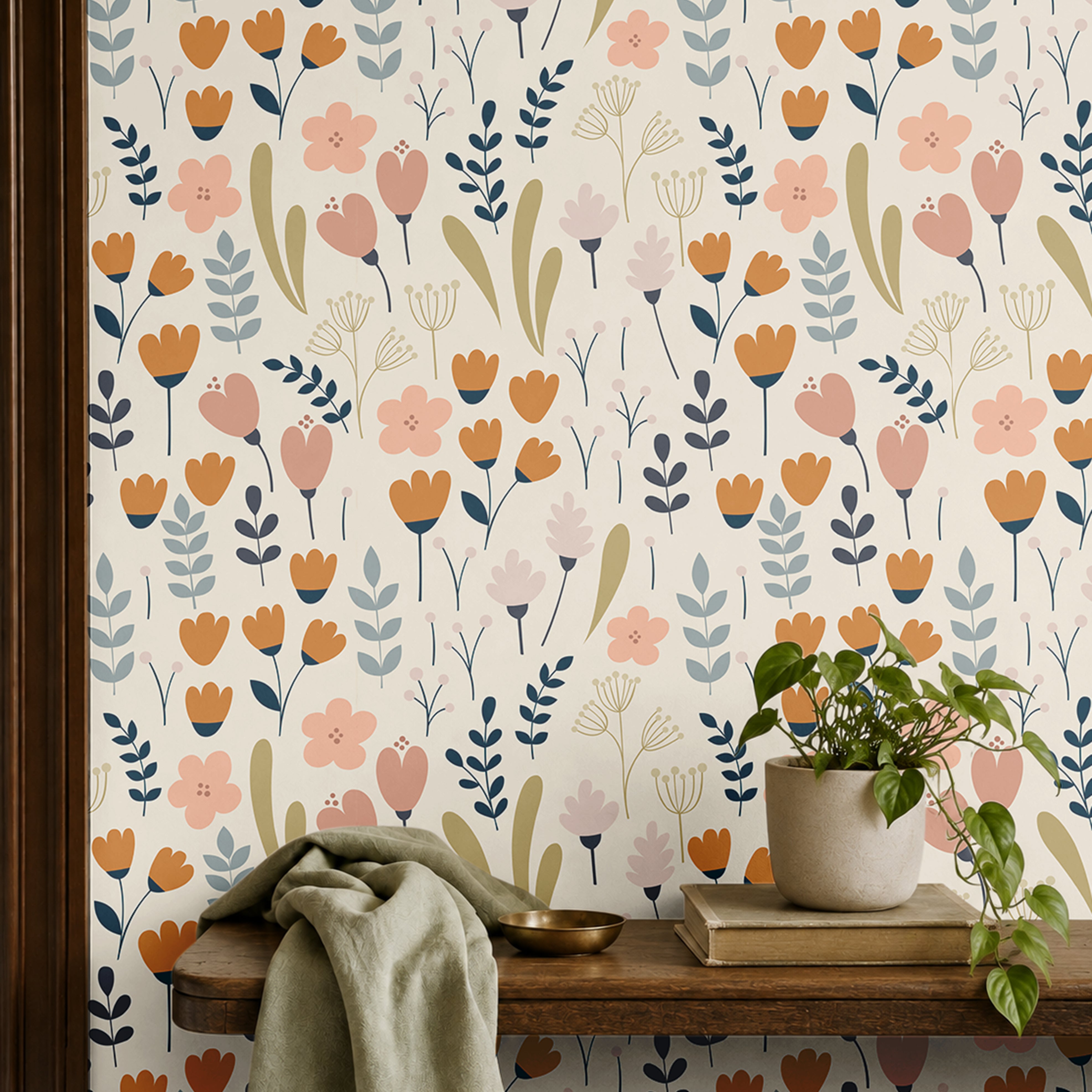 cream floral wallpaper in home office with warm wood shelf with plants books and cloth