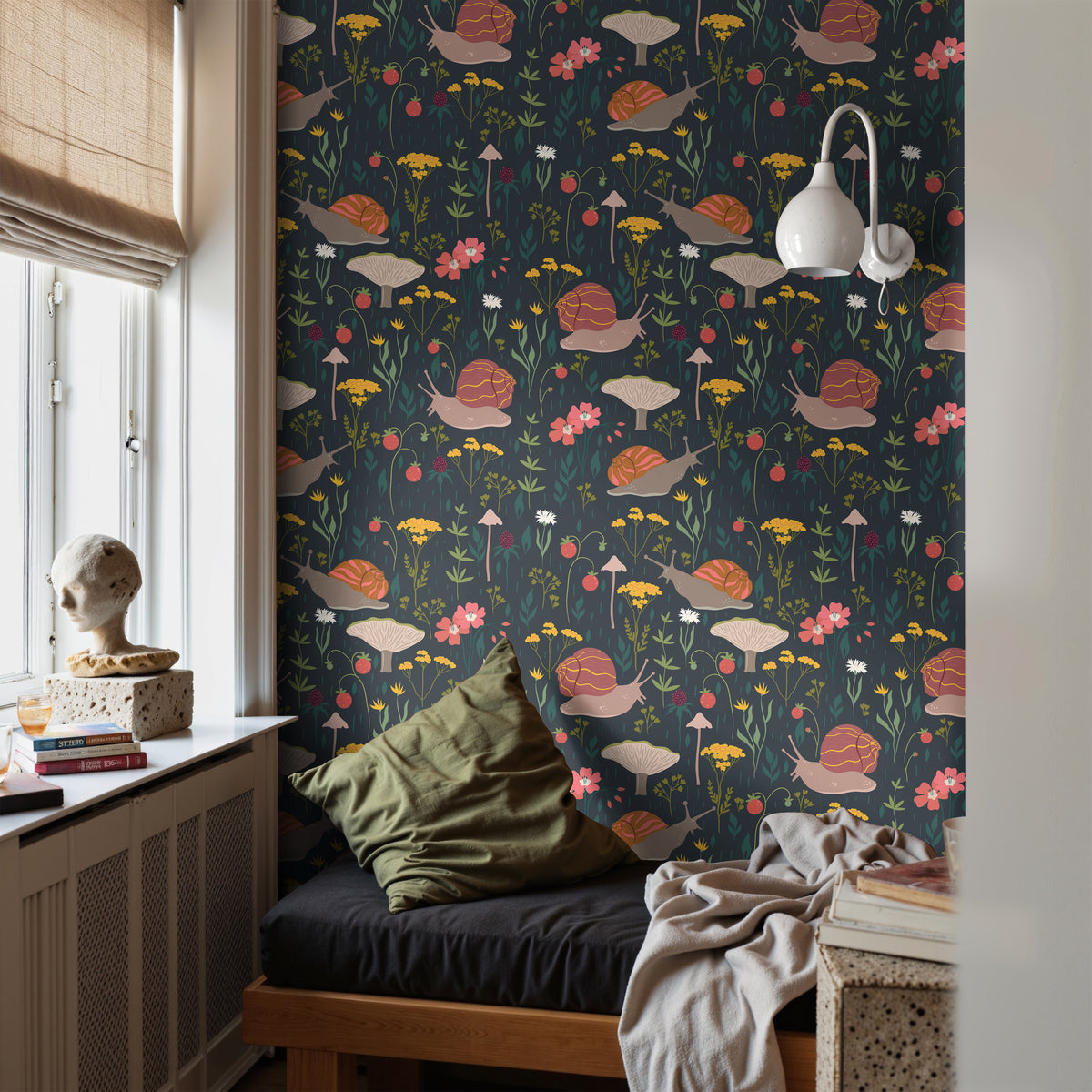 Snails Garden dark botanical wallpaper with whimsical snails, mushrooms and wildflowers styled in a cozy reading nook