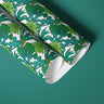 rolls of teal and green botanical contact paper featuring cacti, succulents and
tropical-style foliage.