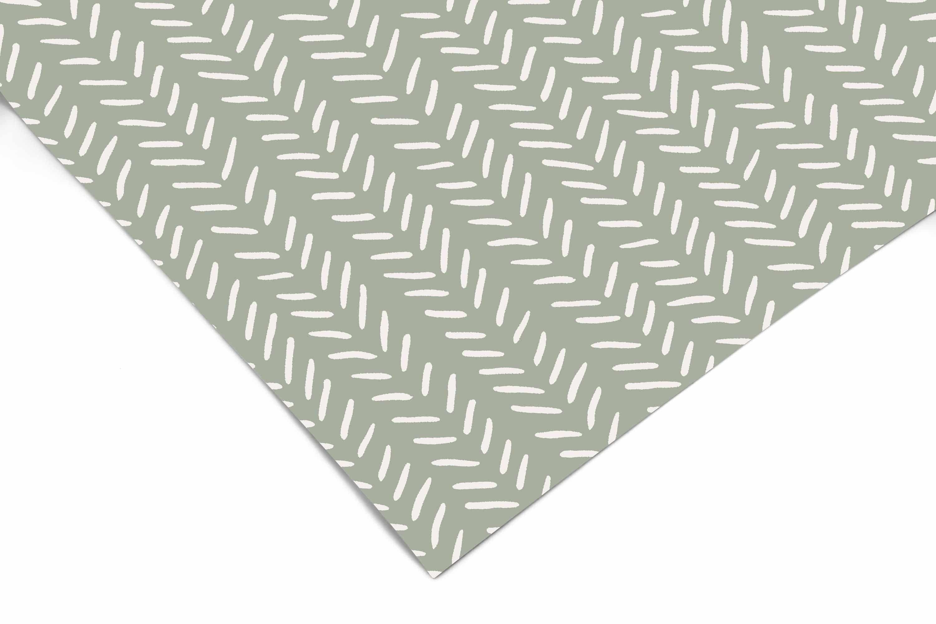 Drawn Chevron Tic Contact Paper close-up showing diagonal rows of small cream dash marks on a sage green background
