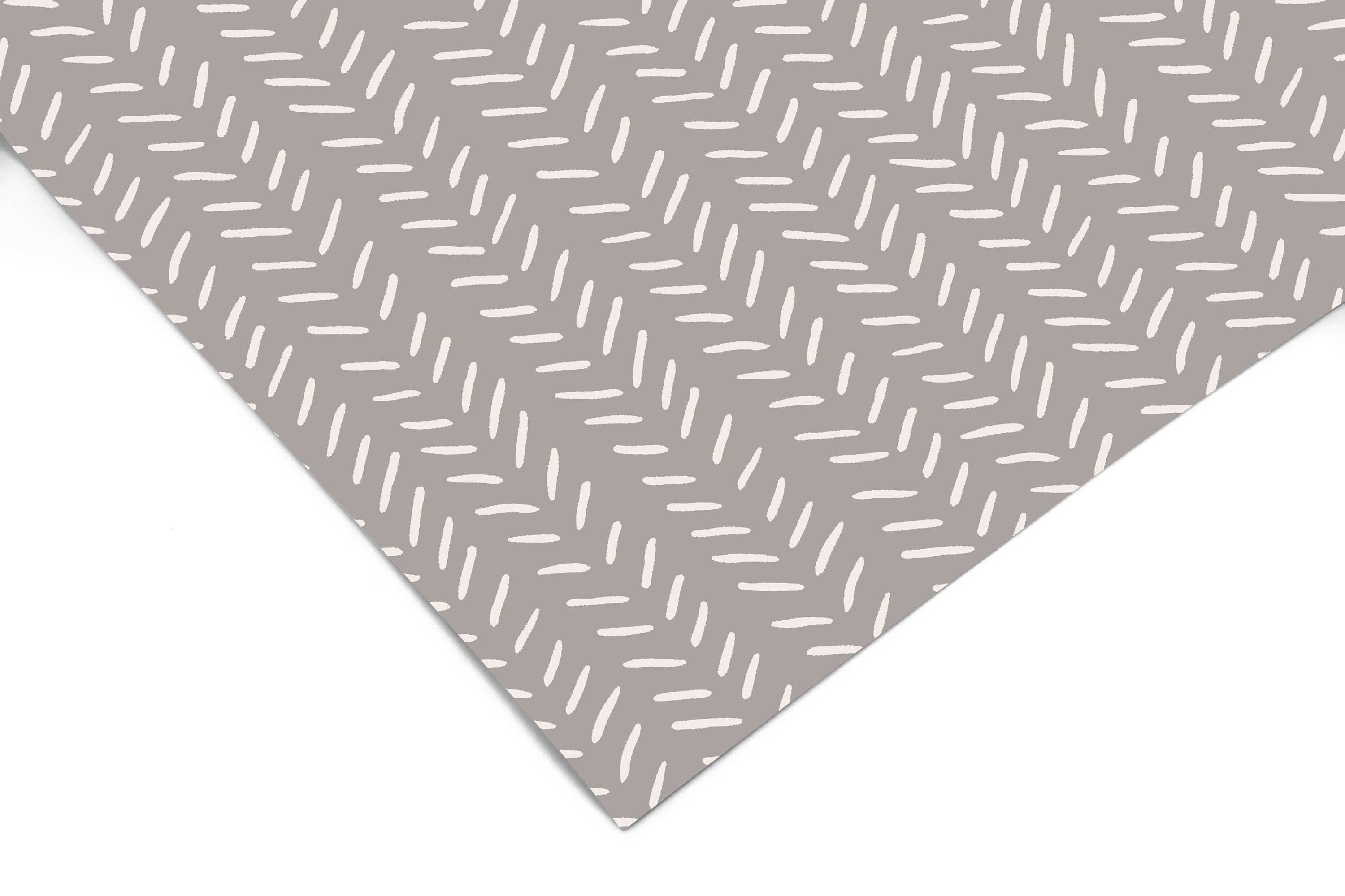 Gray Neutral Chevron Contact Paper close-up showing diagonal rows of small cream dash marks on a warm gray background