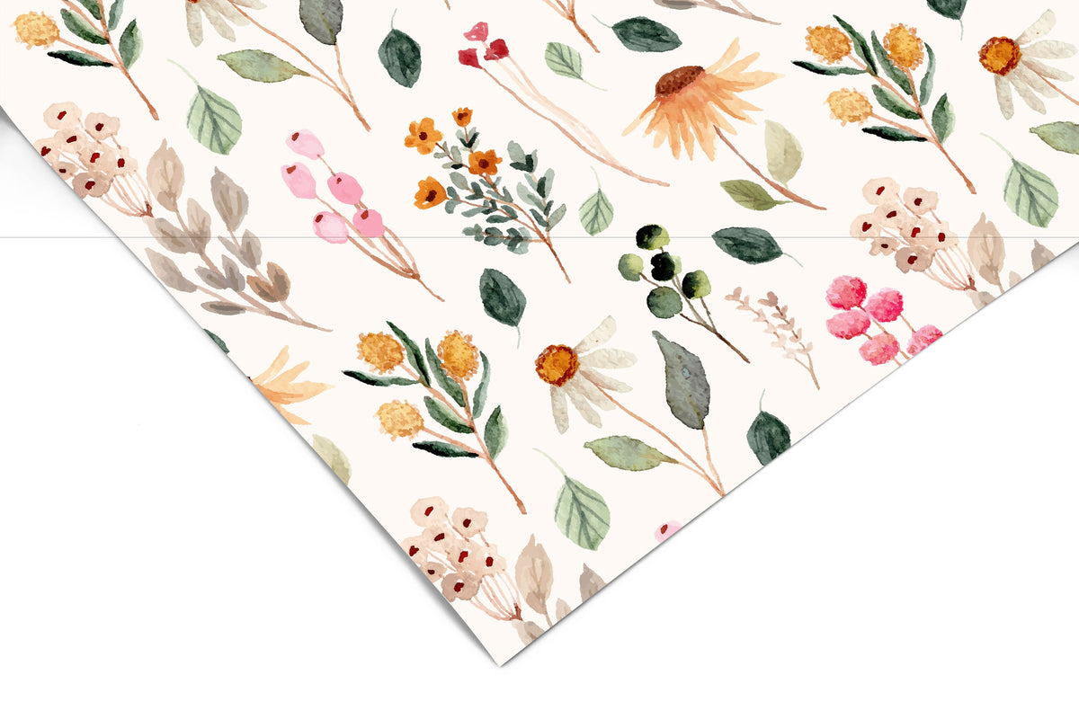 Close-up corner view of Whispering Wildflowers contact paper showing watercolor pink, orange, and yellow wildflowers